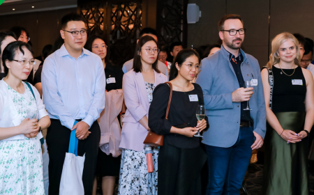 UCD alumni listening to a speaker at a global event in Beijing.